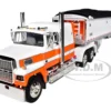 Ford LTL 9000 60" Aerodyne Sleeper With Wilson Pacesetter Grain Trailer Orange And White 1/64 Diecast Model By DCP/First Gear