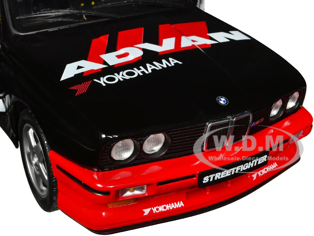 1990 BMW E30 M3 Black And Red With Graphics "ADVAN Drift Team" "Competition" Series 1/18 Diecast Model Car By Solido 5 1990 BMW E30 M3 Black And Red With Graphics "ADVAN Drift Team" "Competition" Series 1/18 Diecast Model Car By Solido - Image 5